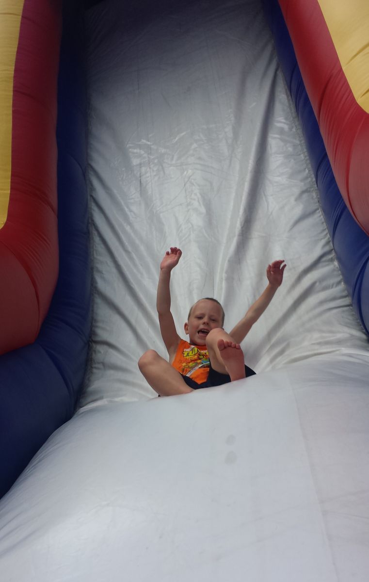 Giant inflatable slide with child going down